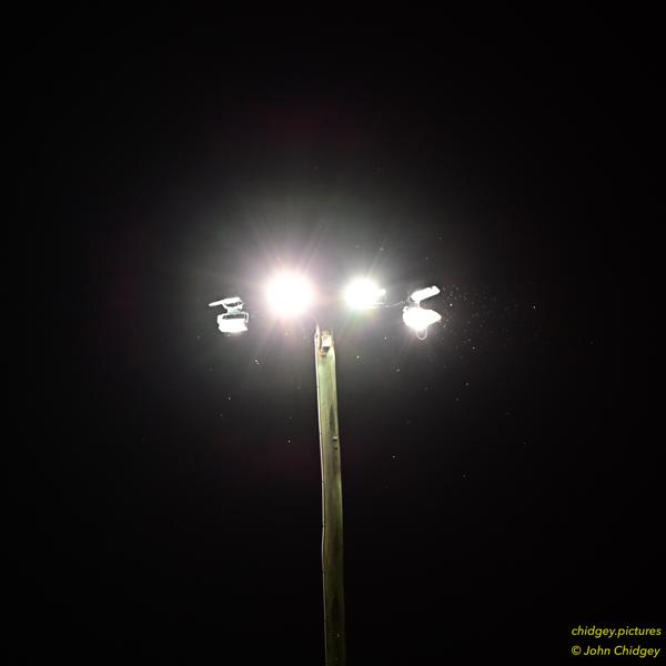 Lights at Night: The cricket ground lightstands at night cast an eerie aura.