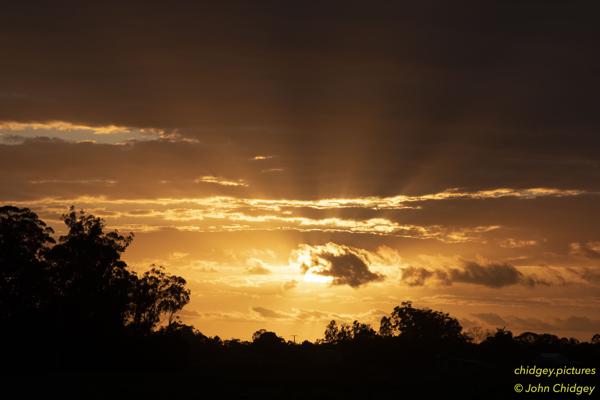 Sunrise Through the Clouds: The sunrise through the clouds this morning.